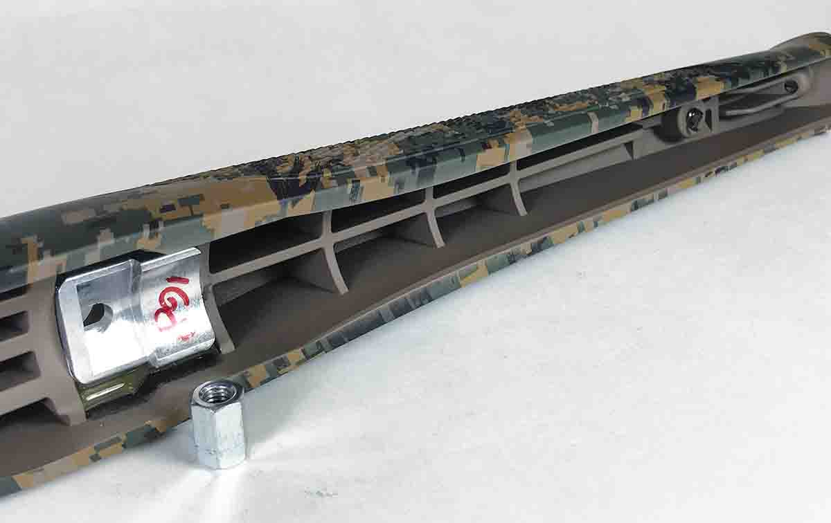 EVER REST action bedding consists of an aluminum block glued in the stock and a nut that threads onto a bolt attached to the bottom of the receiver.
